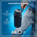 A black stainless steel water bottle is held by a hand. It features a hide-away handle, hygiene cover, and wide mouth opening. The bottle is an award-winning design.