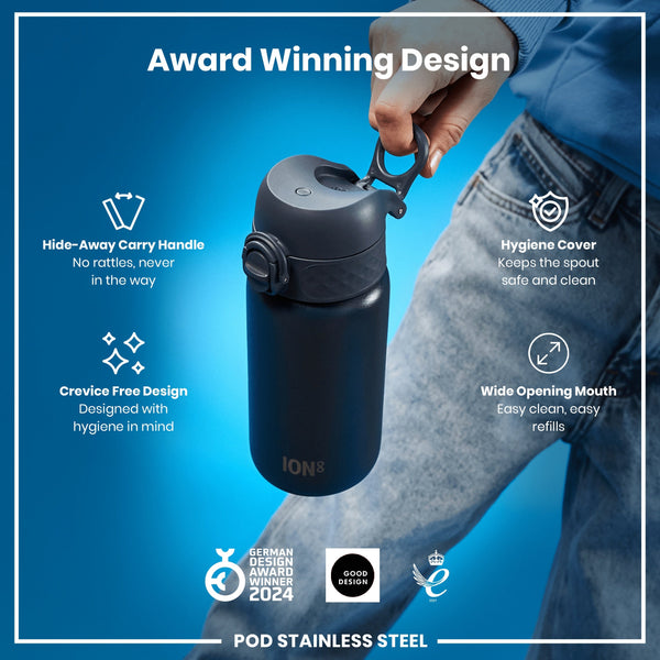 A black stainless steel water bottle is held by a hand. It features a hide-away handle, hygiene cover, and wide mouth opening. The bottle is an award-winning design.