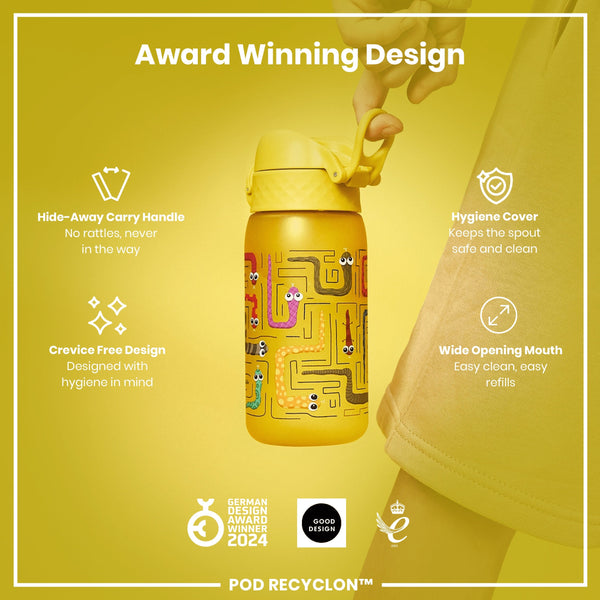 A yellow water bottle, featuring a maze design and a hide-away handle, is being held against a yellow background. The bottle boasts a crevice-free design and wide mouth for easy cleaning and refills. Award logos are displayed below.