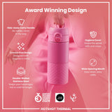 A pink, double-walled stainless steel water bottle is being held; it features a hide-away handle, crevice-free design, hygiene cover, and wide opening mouth. The bottle is award-winning.